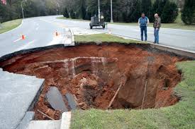 Movement of earth is not covered by standard insurance.  That includes earthquakes, sinkholes and several more items.